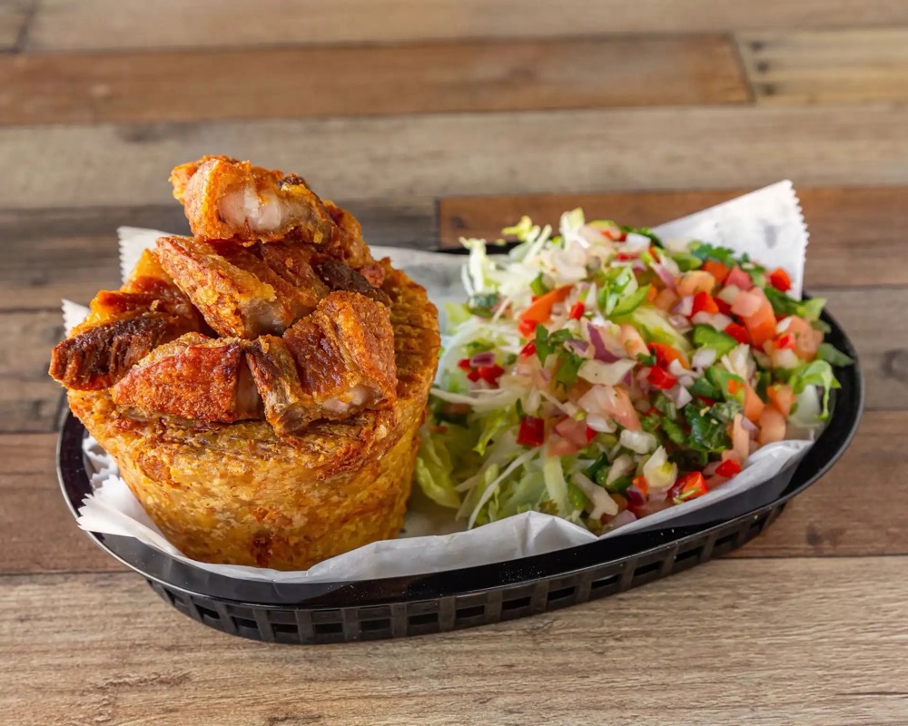 Mofongo de Chicharrón — mashed plantain with crispy pork and salad
